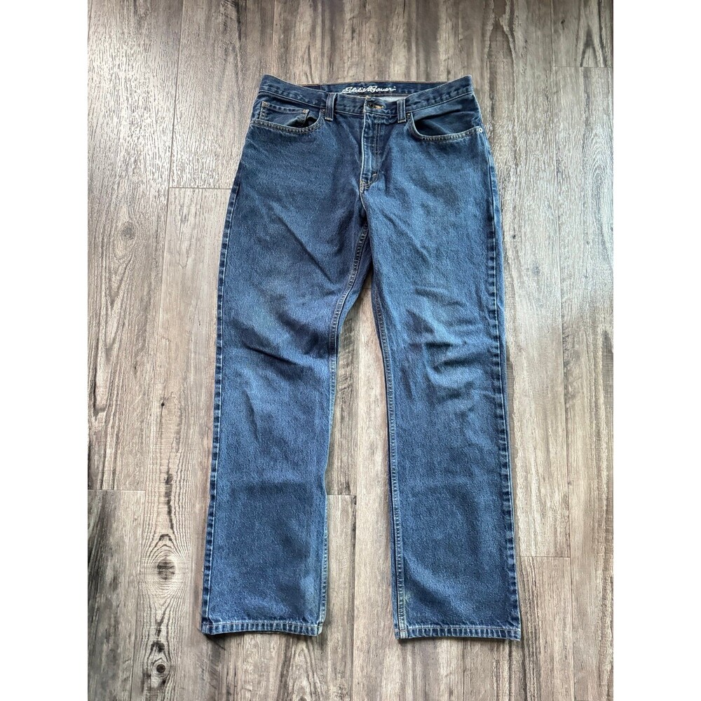 Eddie Bauer medium-wash straight-leg denim jeans feature a classic five-pocket